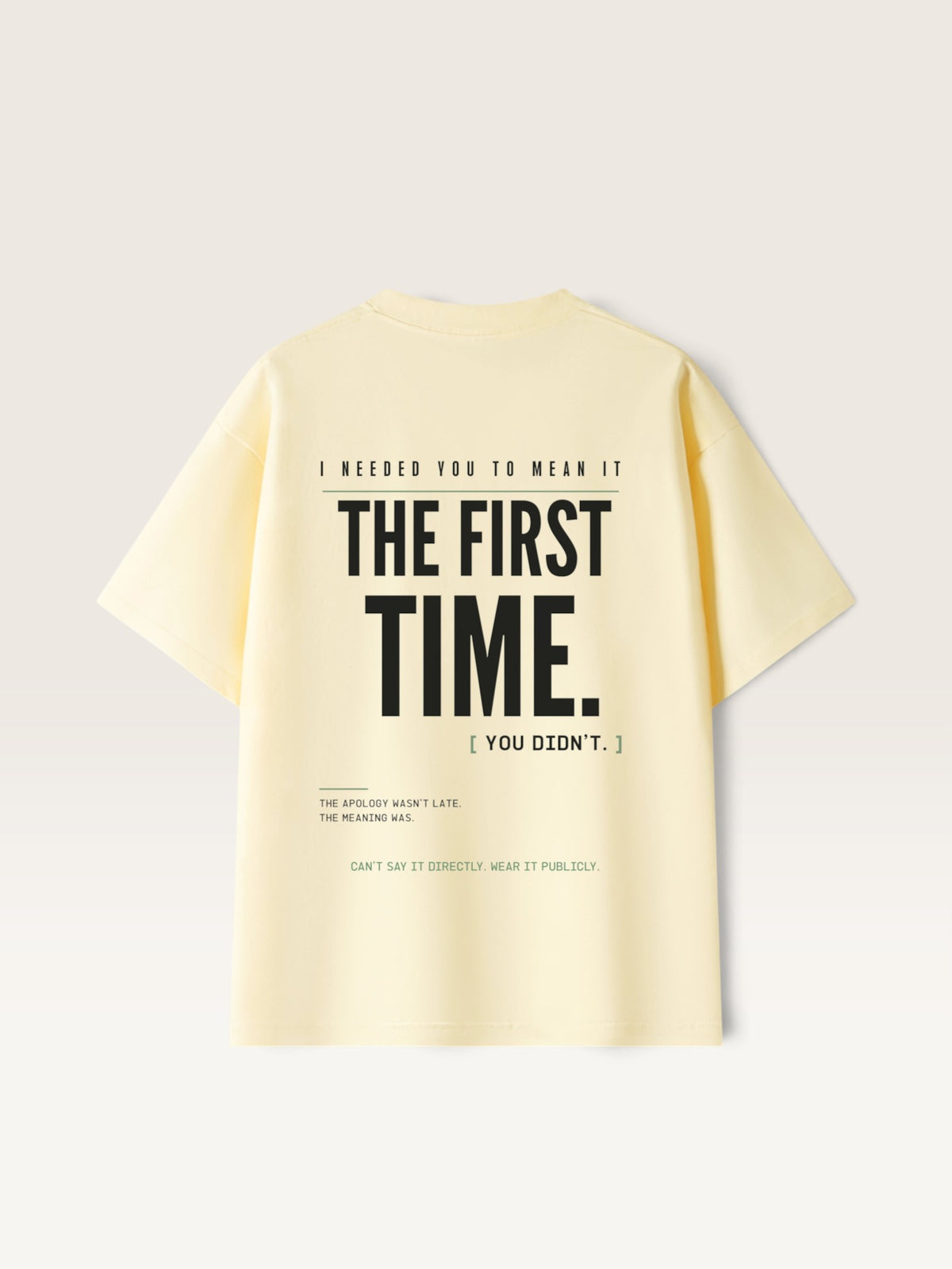 Apricot WEARCAPTION heavyweight pale yellow cotton t-shirt with black typographic back print featuring bold text design.
