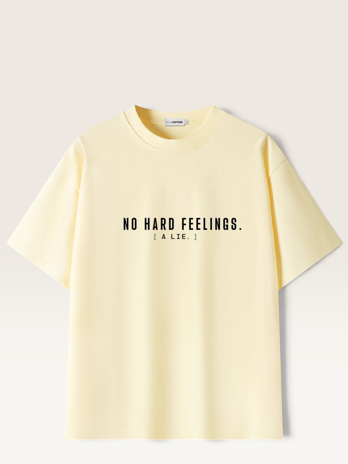 Apricot - heavyweight cotton oversized t-shirt with white NO HARD FEELINGS A LIE text print on the front