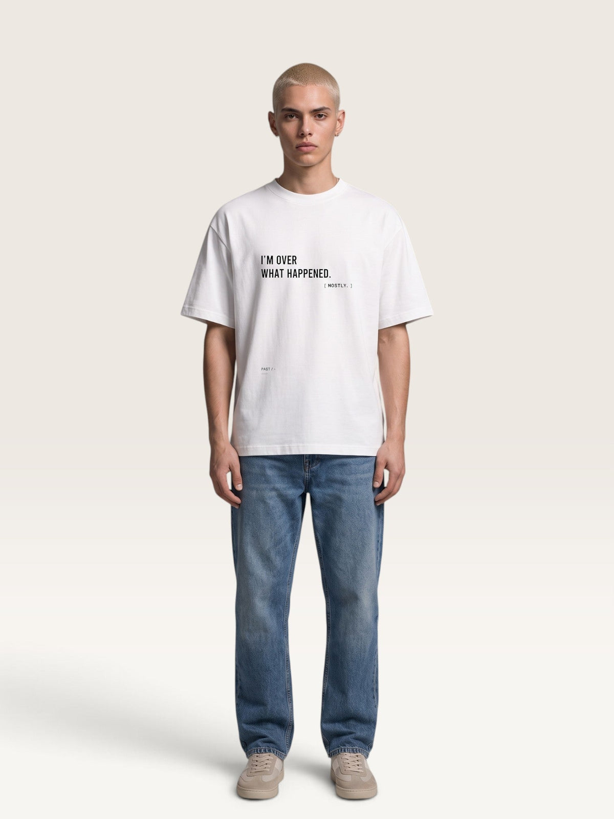 WEARCAPTION white heavyweight cotton oversized t-shirt with black text print on front, worn by a male model.