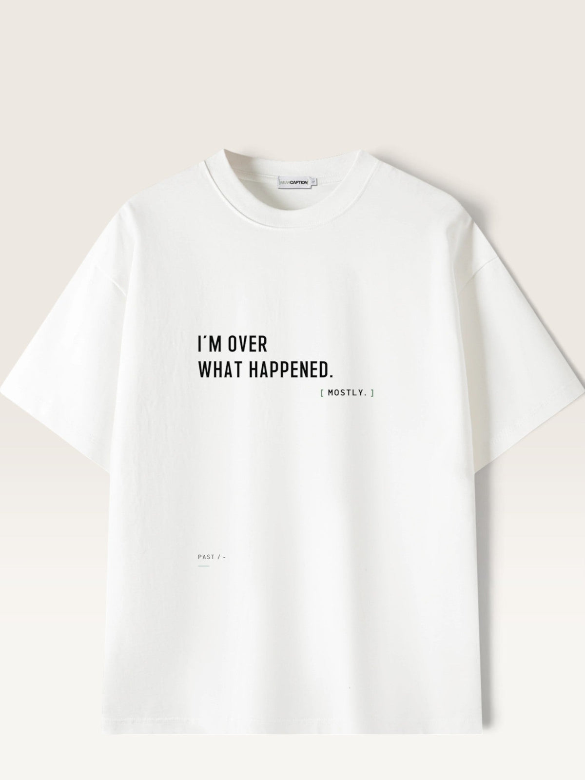 WEARCAPTION white heavyweight cotton oversized t-shirt with black text I'M OVER WHAT HAPPENED printed on the front