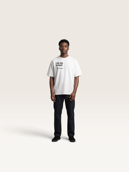 White WEARCAPTION white heavyweight cotton oversized t-shirt with black front text graphic worn by a young man