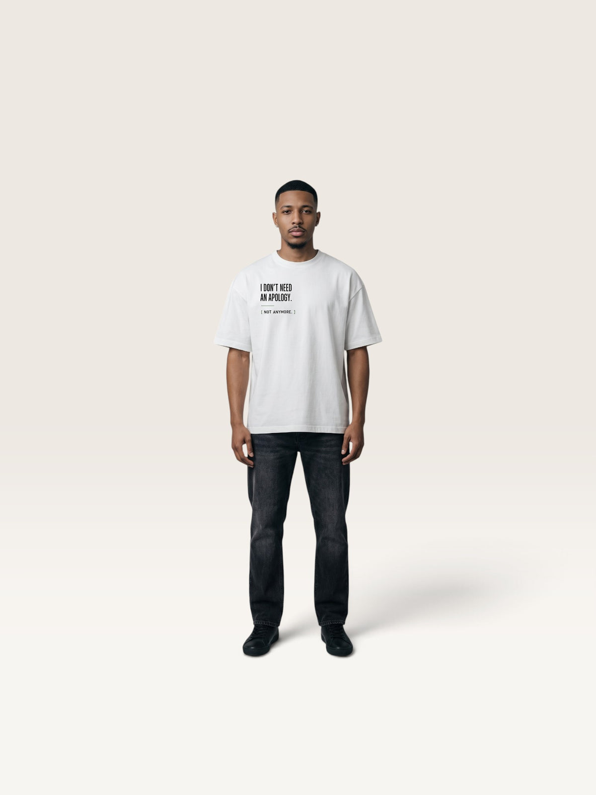 White WEARCAPTION white heavyweight cotton oversized t-shirt with I DON'T NEED AN APOLOGY text print on a male model