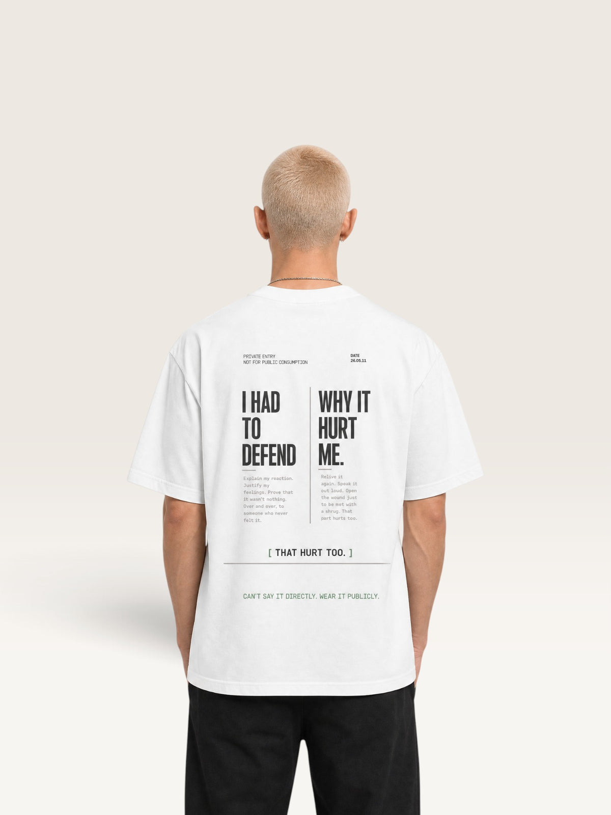 White WEARCAPTION white heavyweight cotton oversized t-shirt with black typographic back print on a male model