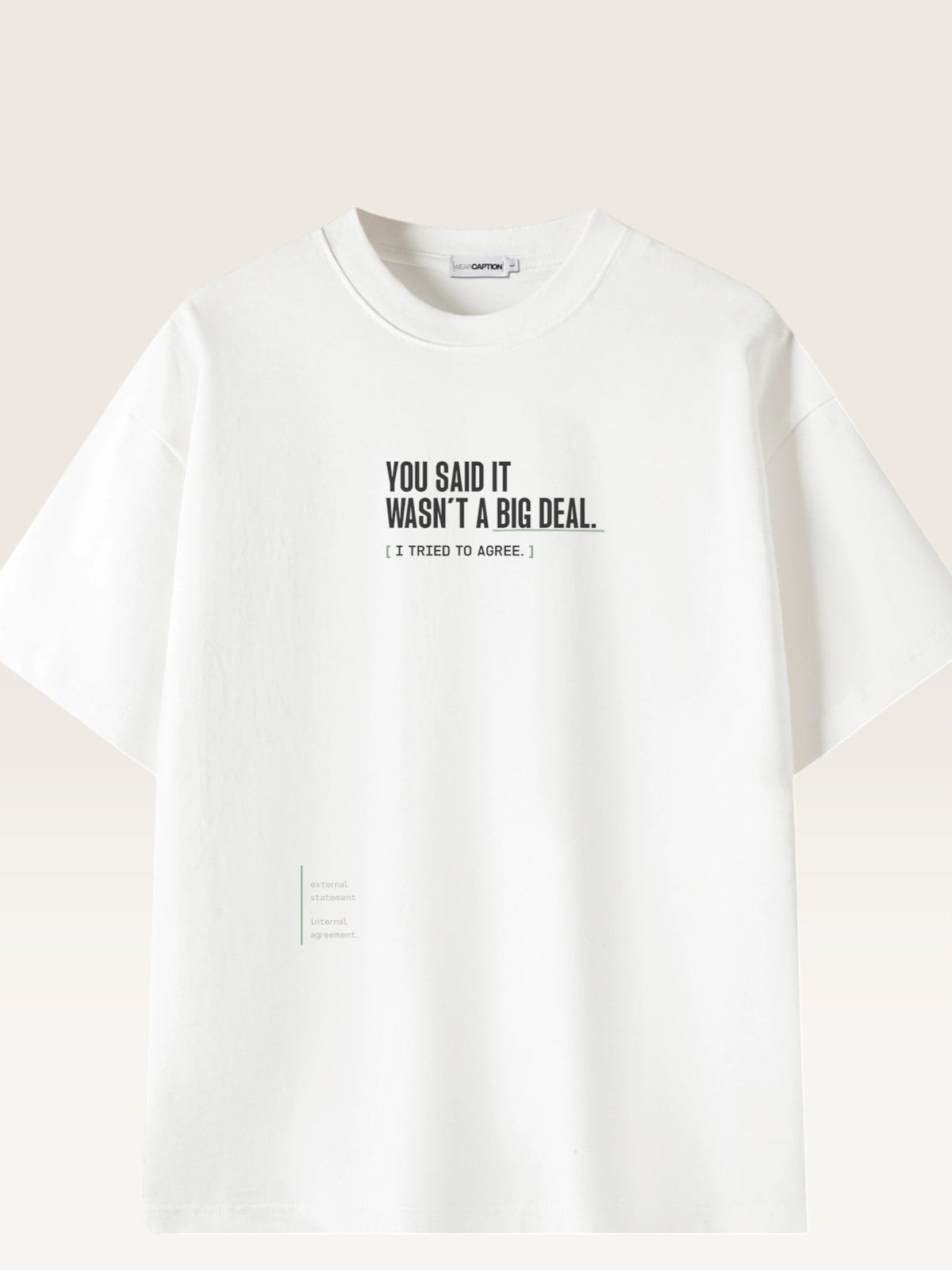 White - heavyweight cotton oversized t-shirt with white IT WASN'T A BIG DEAL graphic print on the front
