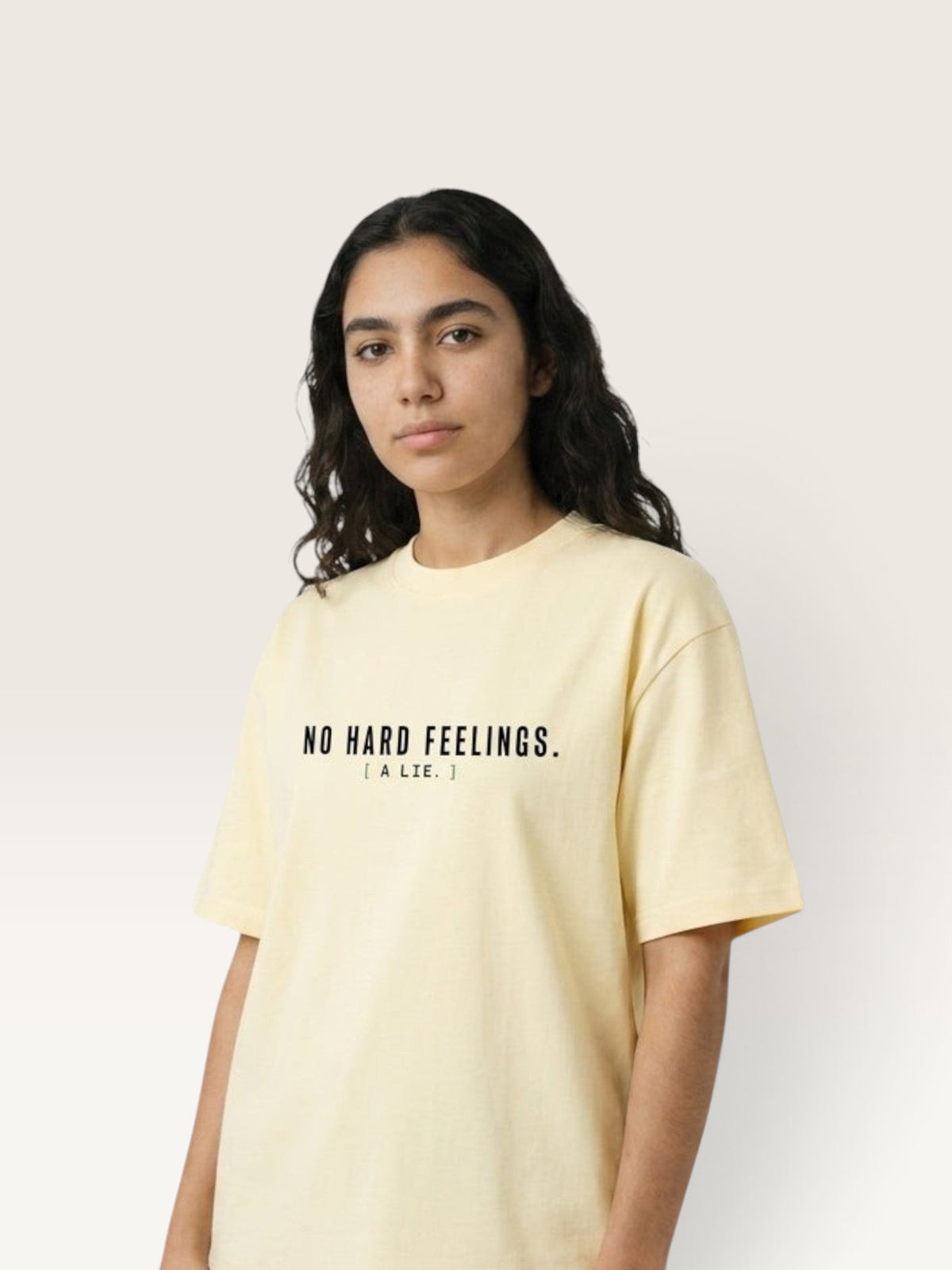 Apricot - heavyweight cotton oversized t-shirt with white NO HARD FEELINGS A LIE text print on the front